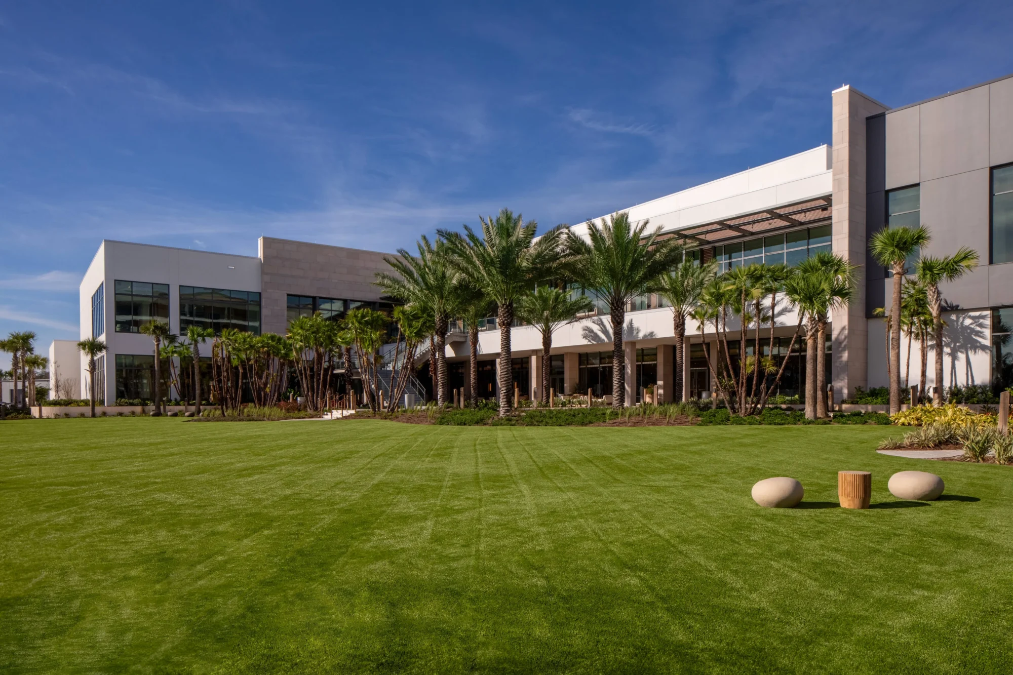 Modern building with green lawn, palm trees, perfect for an Orlando wedding destination.