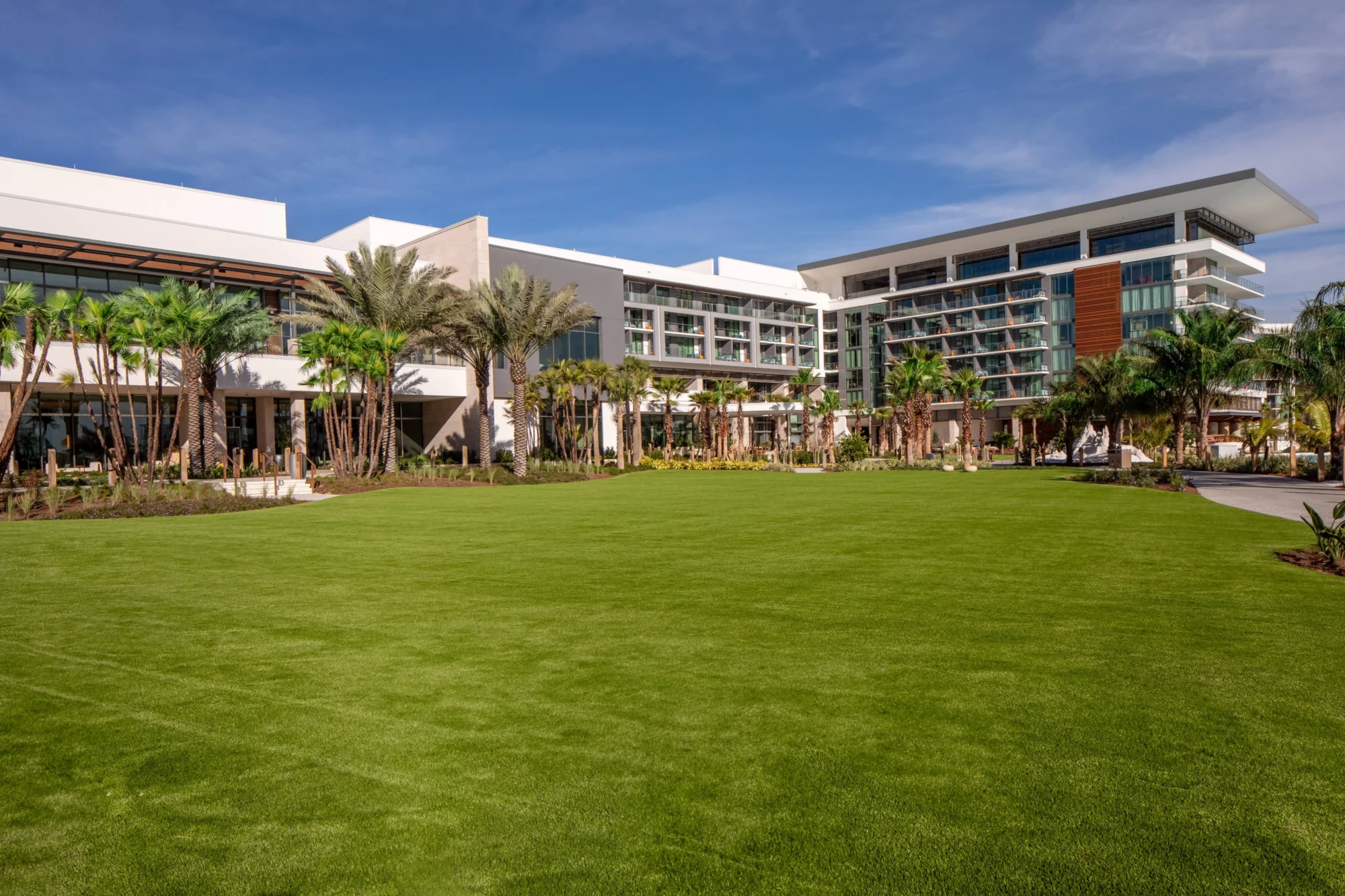 Lush green lawn in front of the Conrad Orlando, a premier Orlando wedding destination.