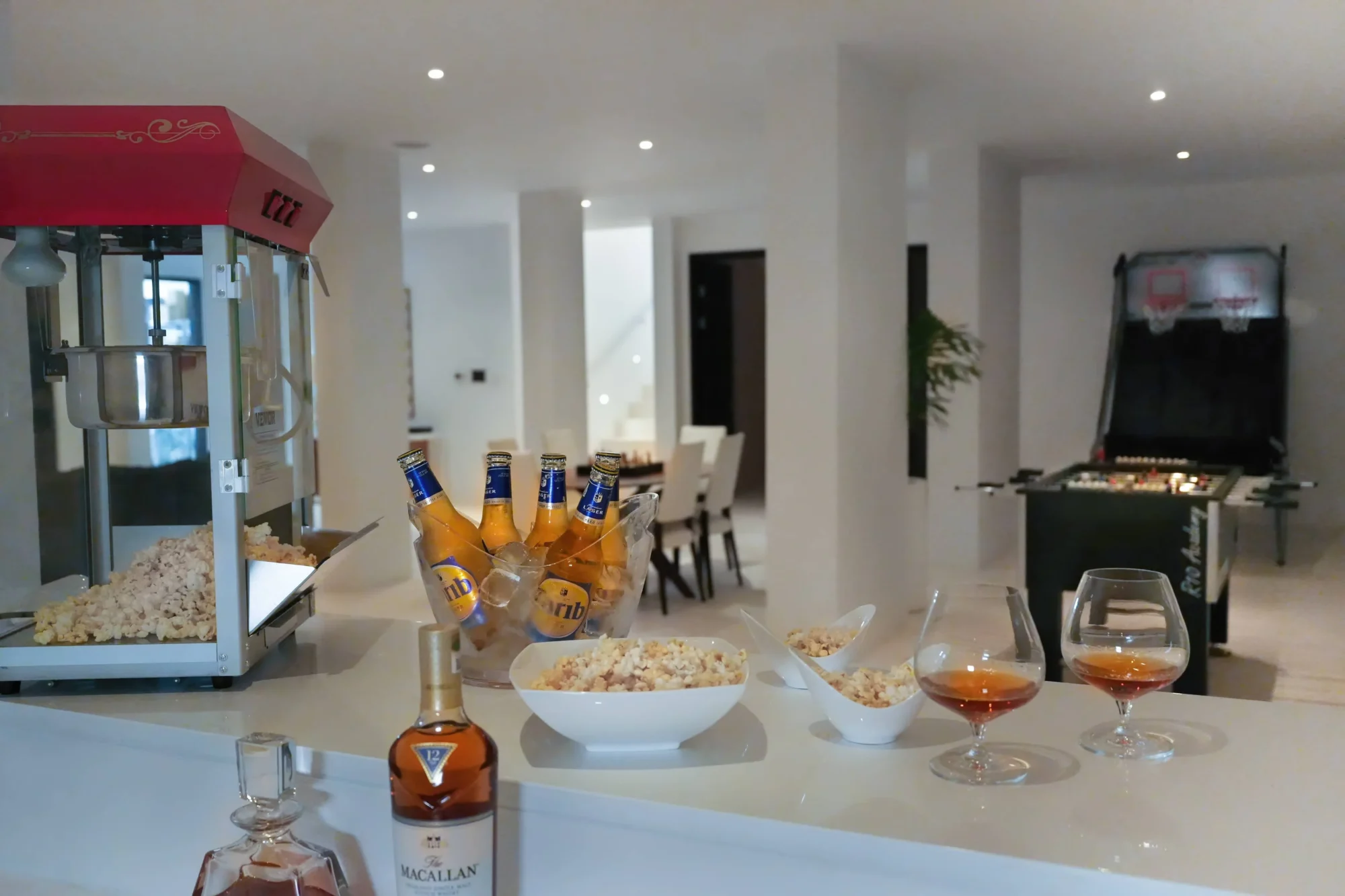 Popcorn, drinks, and snacks on a bar in a luxurious beach house. Perfect for an Anguilla destination wedding.