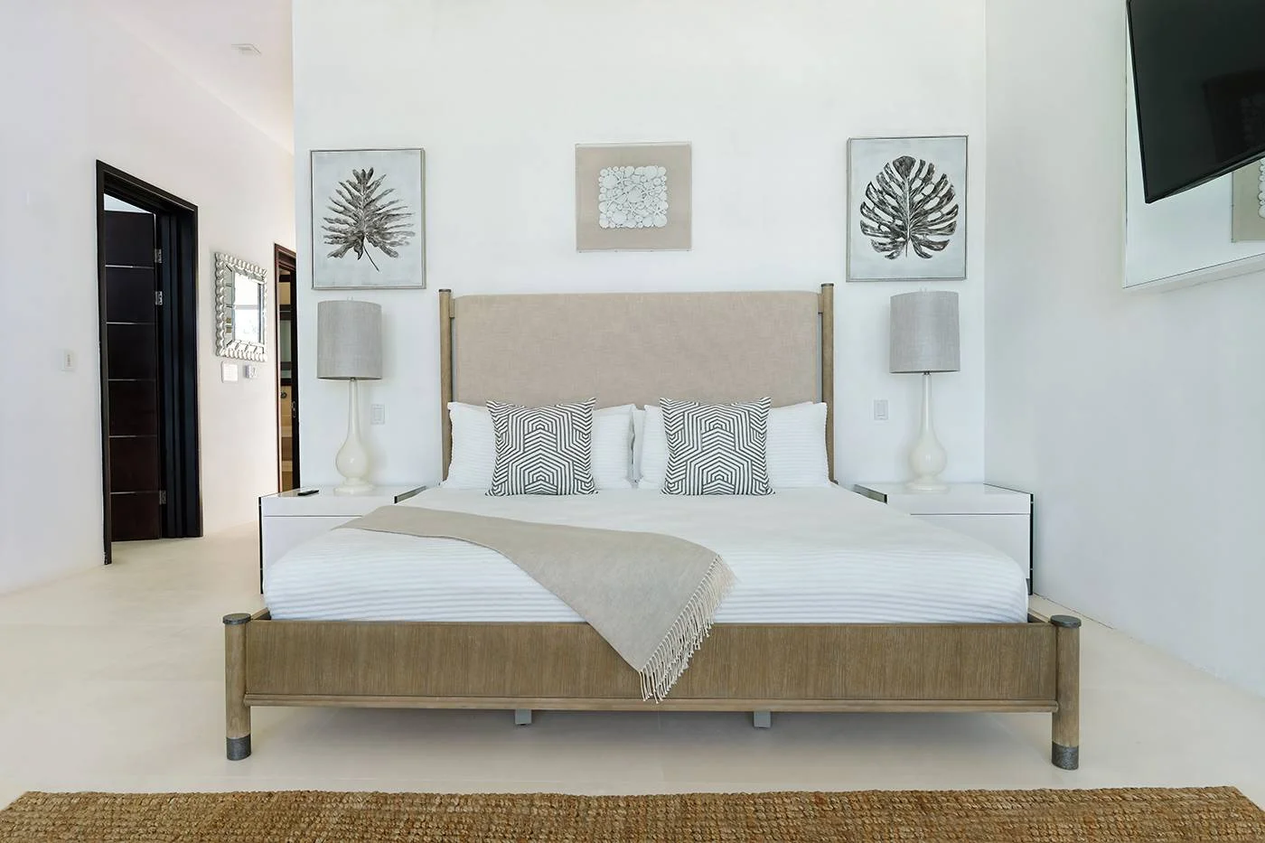 Elegant bedroom in a beachfront Anguilla villa, perfect for a destination wedding.