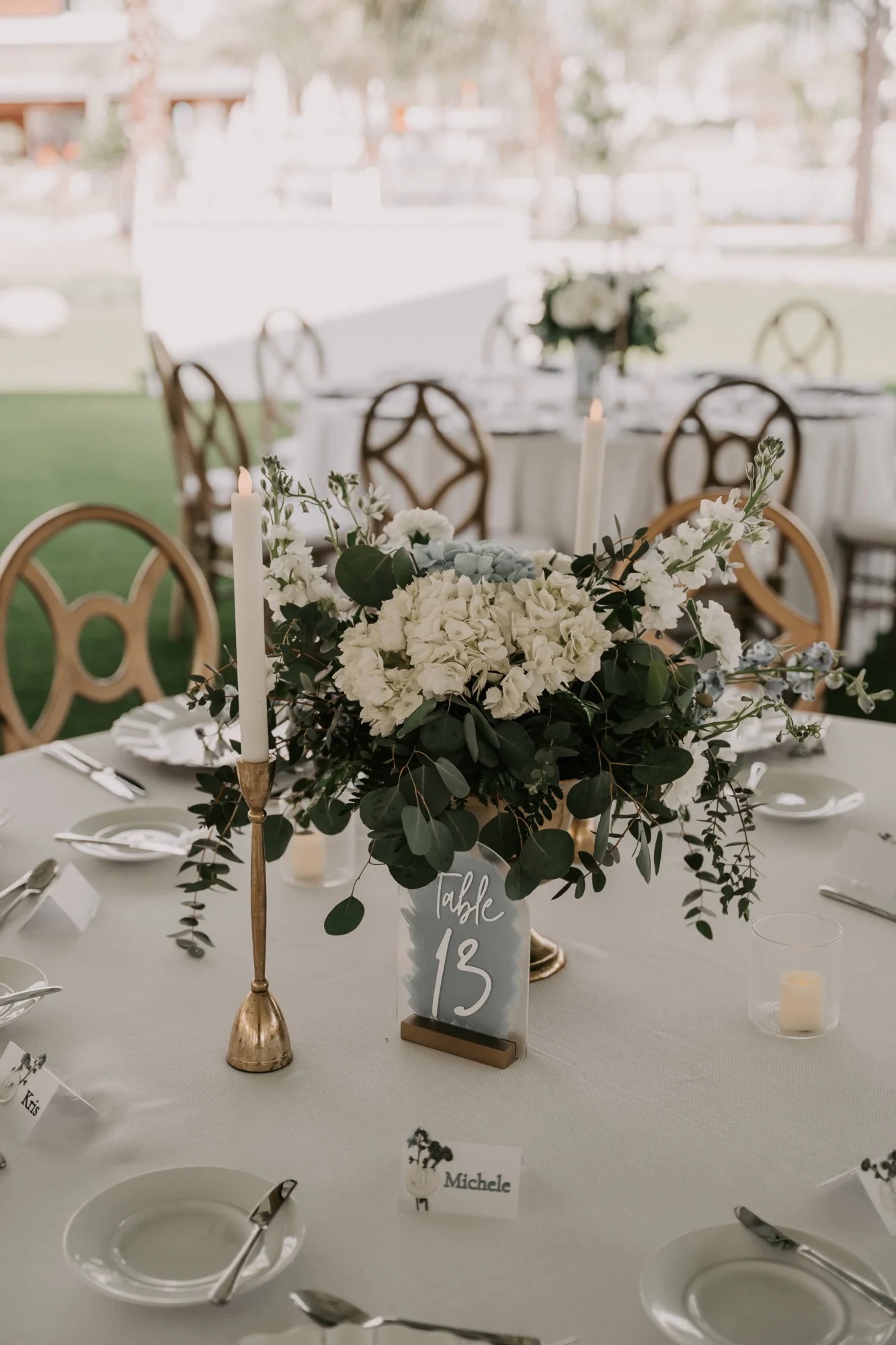 Elegant Orlando wedding destination table setting with floral centerpiece and table number 13