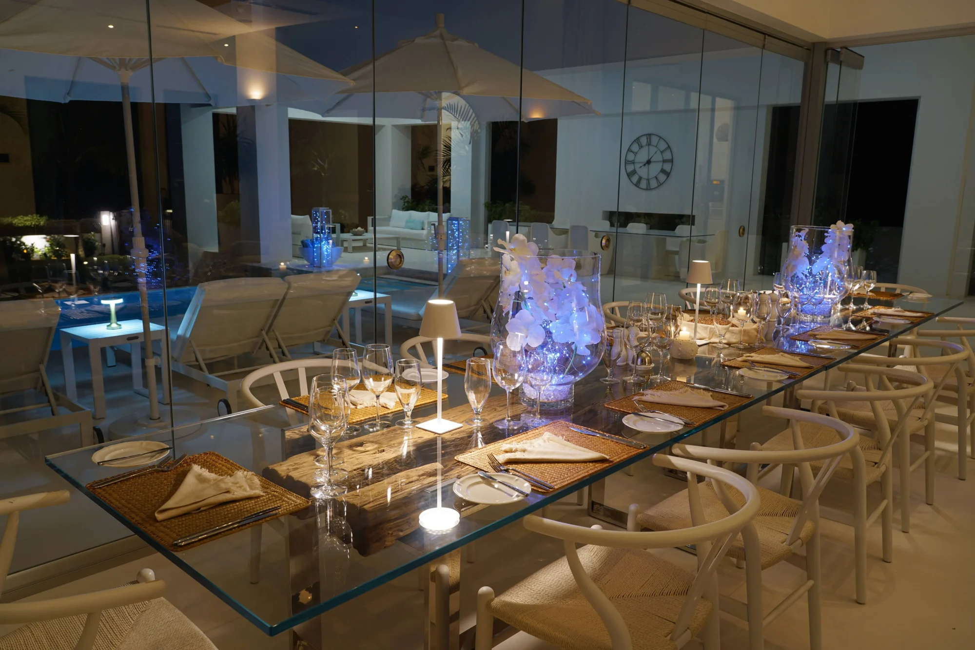 Elegant outdoor dining table set for a wedding reception at a beach house in Anguilla.