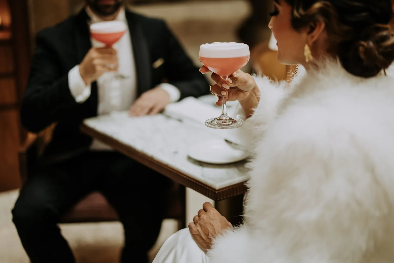 Couple enjoying cocktails at Palácio Ludovice Hotel.
