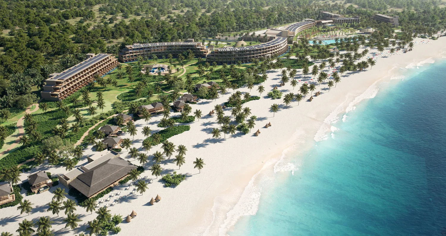 Aerial view of Zemi Miches All-Inclusive Resort, showcasing beachfront villas and lush landscaping.