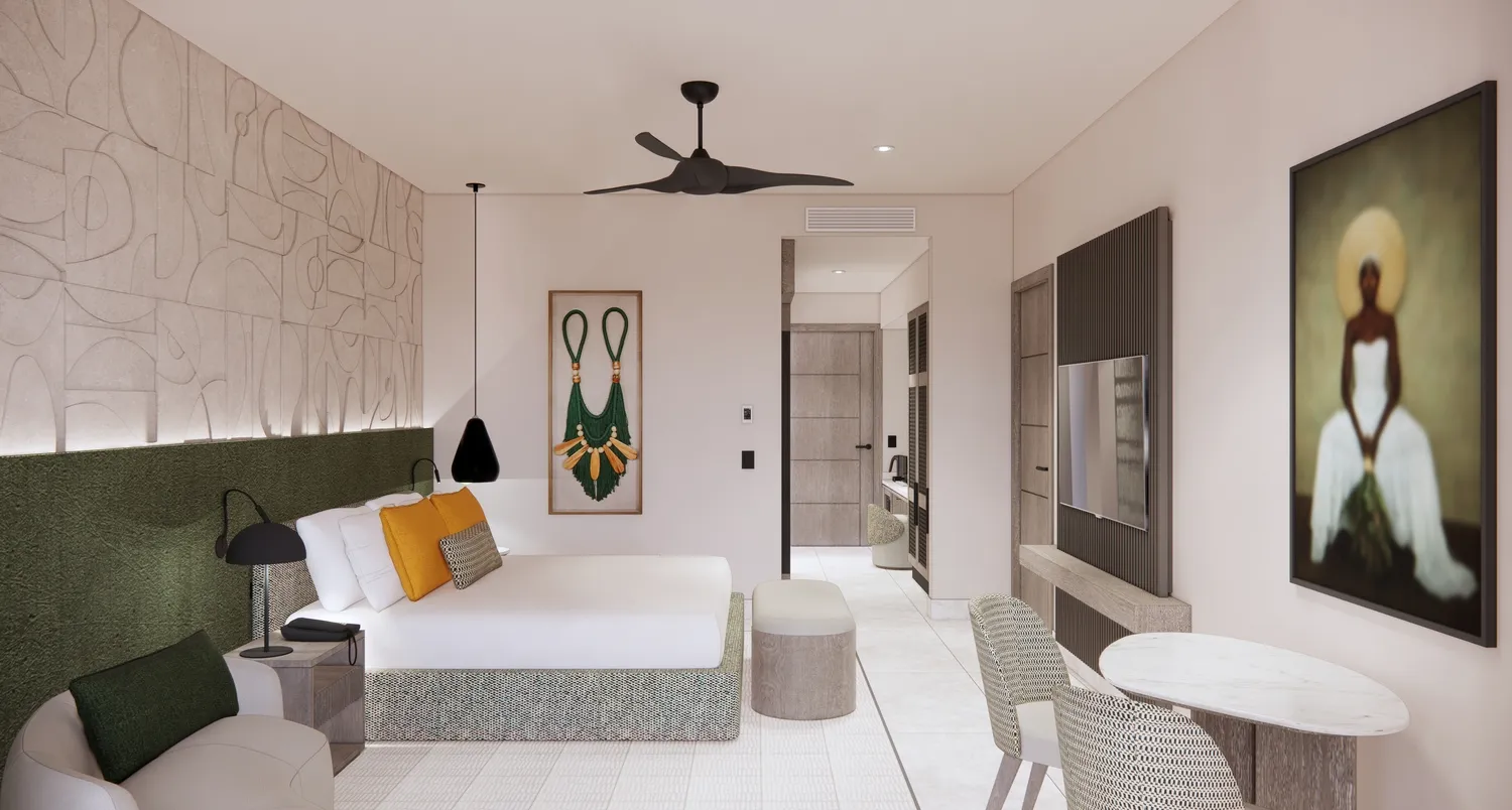 Modern guest room at the Zemi Miches All-Inclusive Resort, featuring a comfortable bed and seating area.