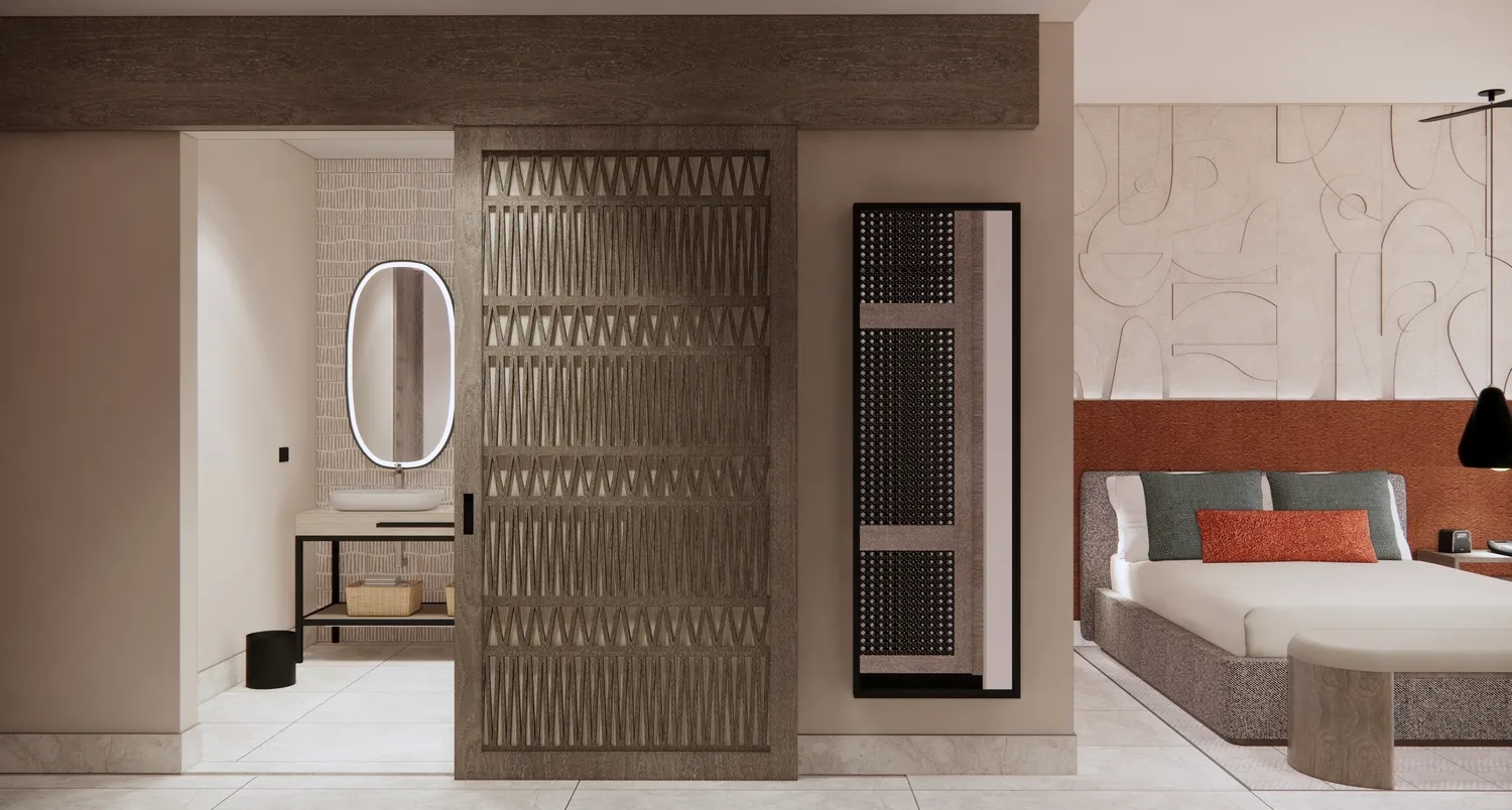 Modern suite at the Zemi Miches All-Inclusive Resort, featuring a bedroom and bathroom with sliding wood partition.