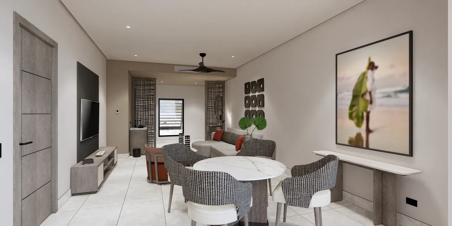 Modern suite at the Zemi Miches All-Inclusive Resort, featuring a living area with seating and dining table.