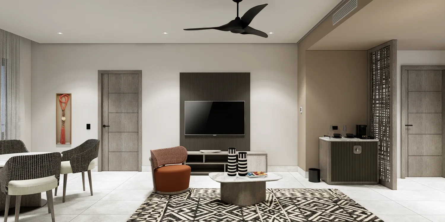 Modern suite at the Zemi Miches All-Inclusive Resort, featuring a living area with seating and a TV.