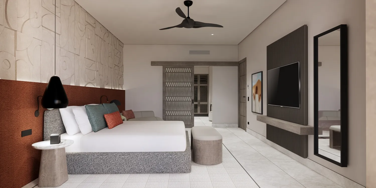 Modern suite at the Zemi Miches All-Inclusive Resort, featuring a king bed and sitting area.