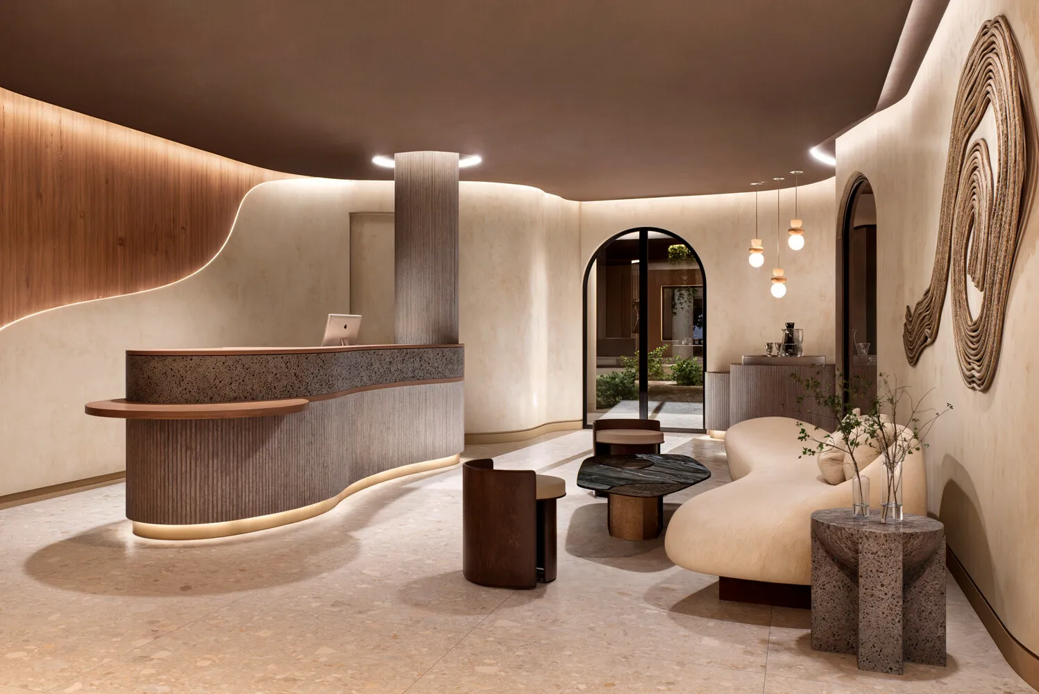 Modern lobby at the Zemi Miches All-Inclusive Resort. Features a curved reception desk and comfortable seating.