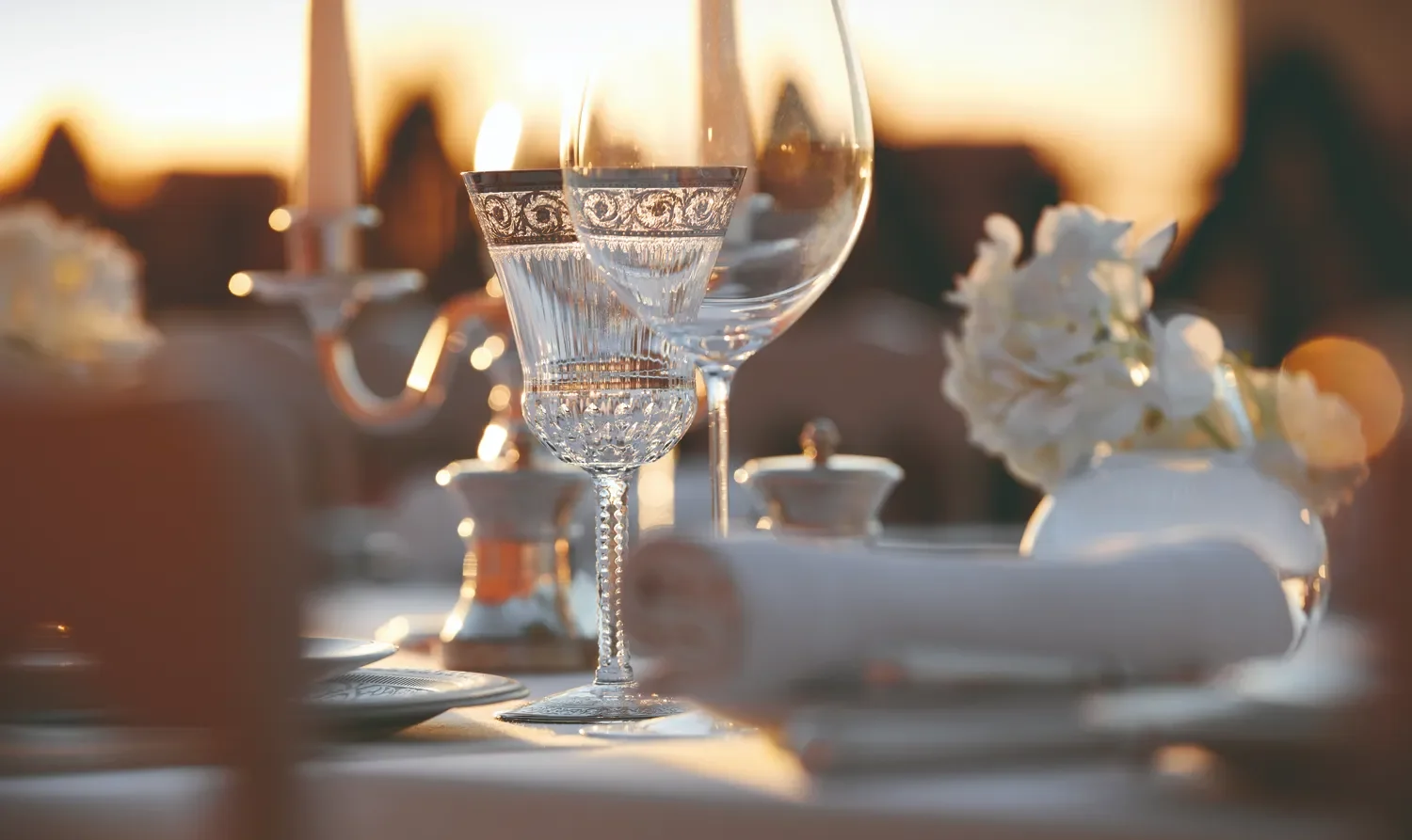 Elegant glassware and floral centerpiece at a Royal Mansour Marrakech celebration.