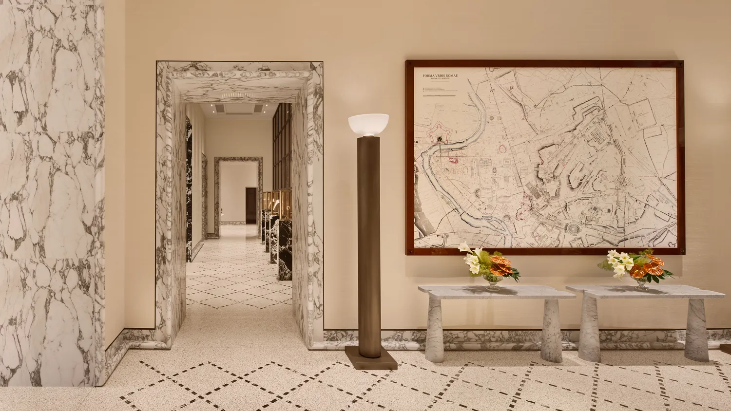 Elegant hallway at the Bvlgari Hotel Roma, featuring marble floors and walls. Ideal for weddings.