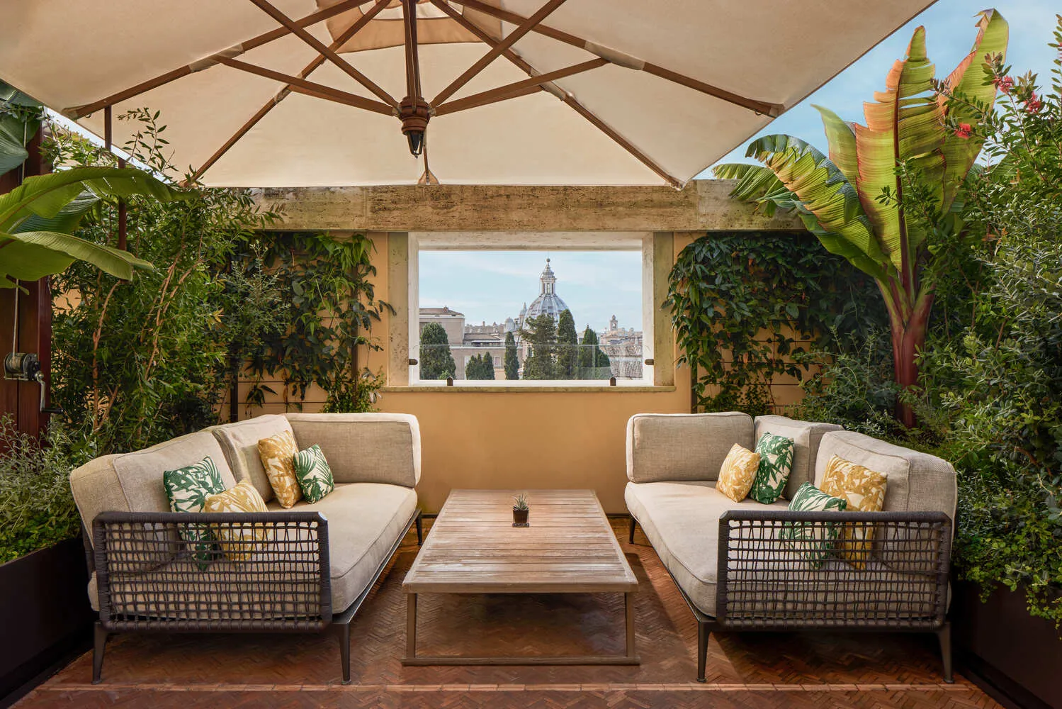 Luxurious rooftop terrace at the Bvlgari Hotel Roma, perfect for weddings, with stunning city views.