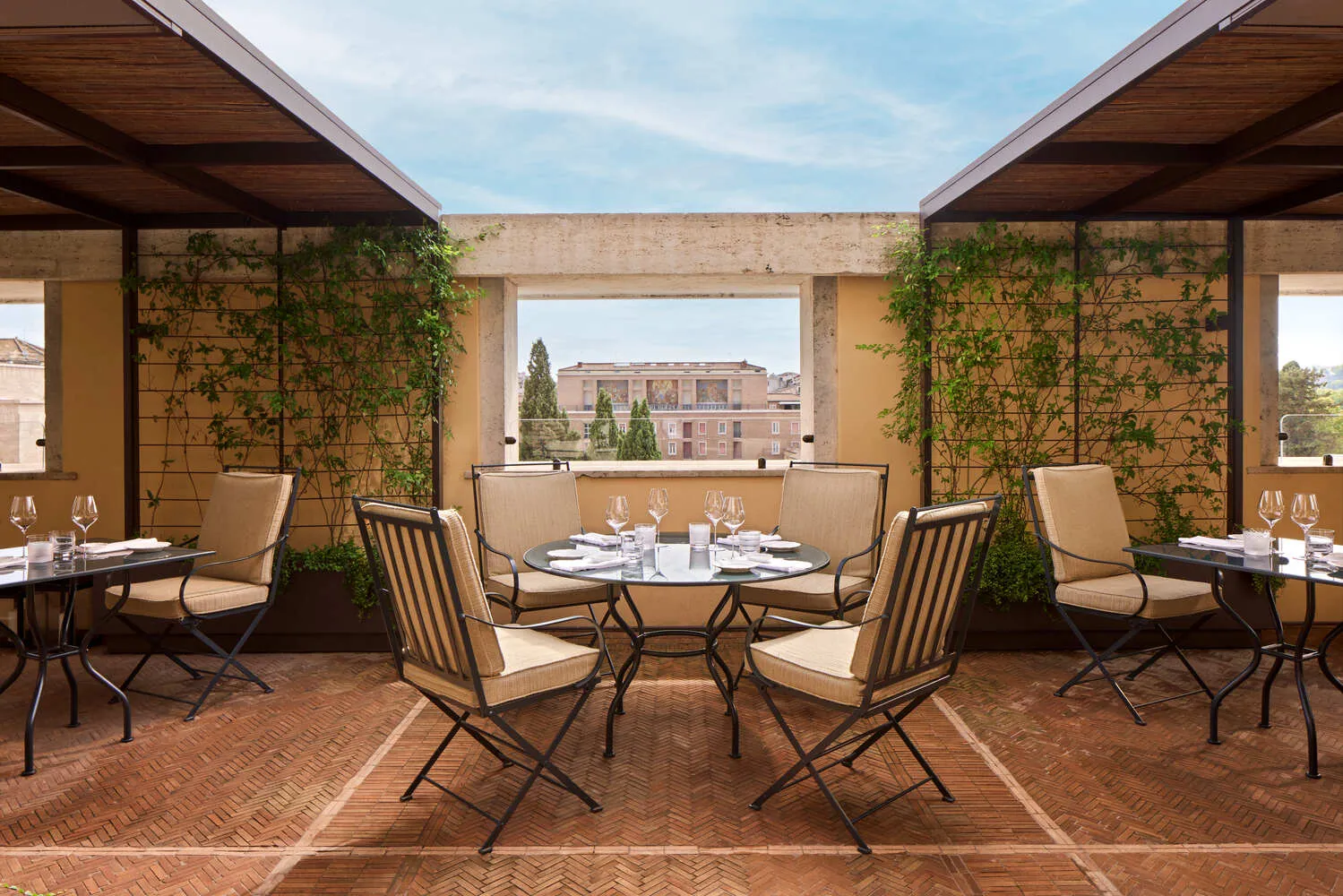 Romantic rooftop dining setting at the Bvlgari Hotel Roma, perfect for weddings.