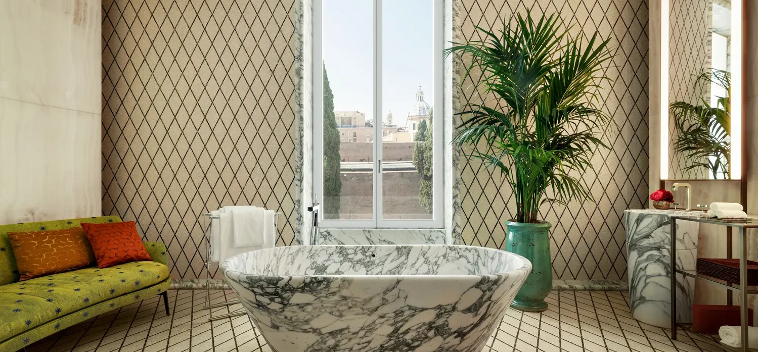 Luxury marble bathtub in a Bvlgari Hotel Roma bathroom.
