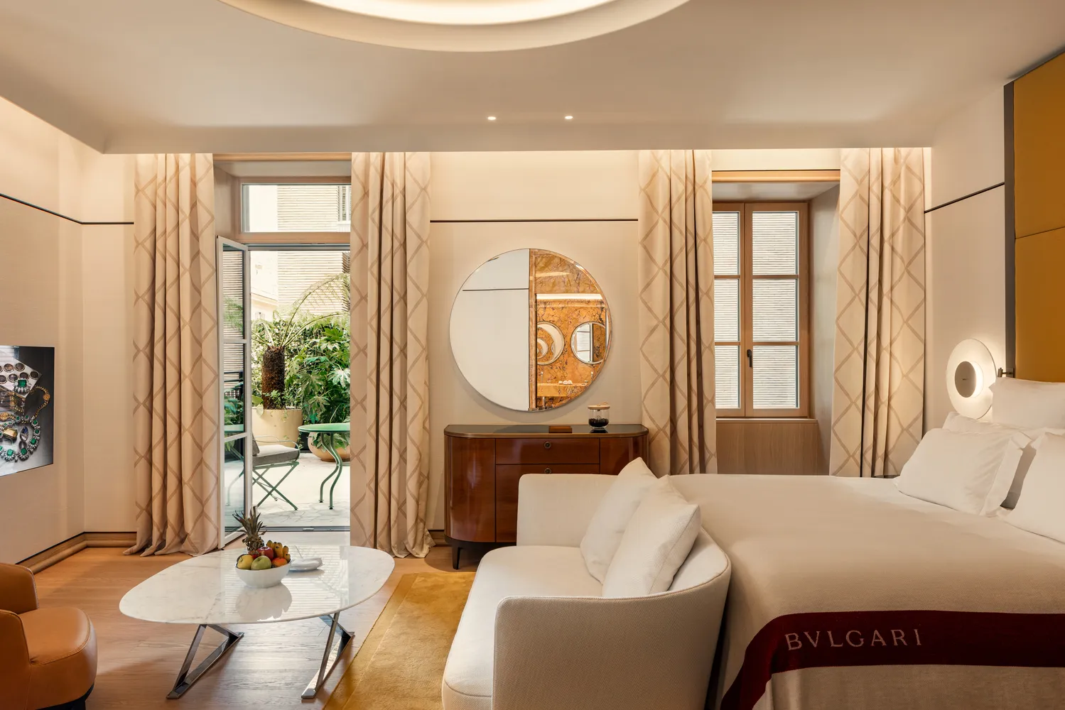 Luxurious Bvlgari Hotel Roma bedroom with patio access.