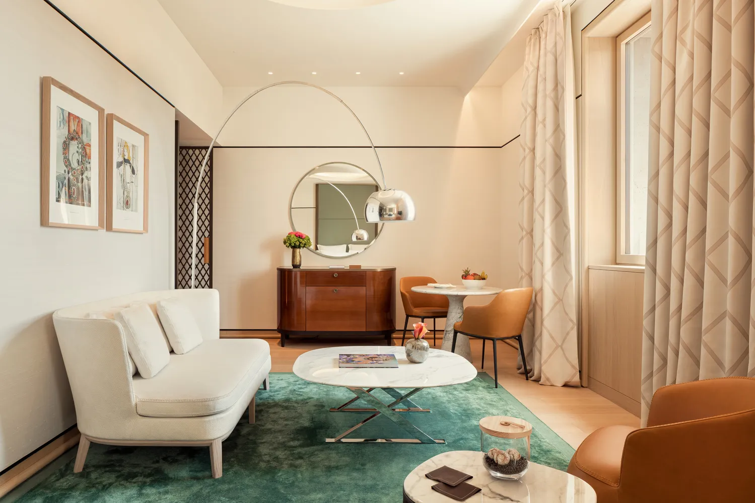 Elegant suite at the Bvlgari Hotel Roma, featuring a comfortable seating area perfect for a romantic wedding stay.