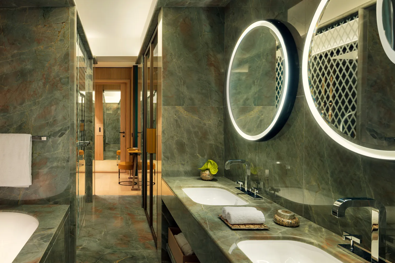 Luxurious bathroom at the Bvlgari Hotel Roma, featuring a double vanity and marble finishes.