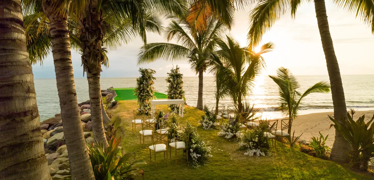 Destination wedding ceremony setup at a Puerto Vallarta Marriott resort overlooking the ocean.
