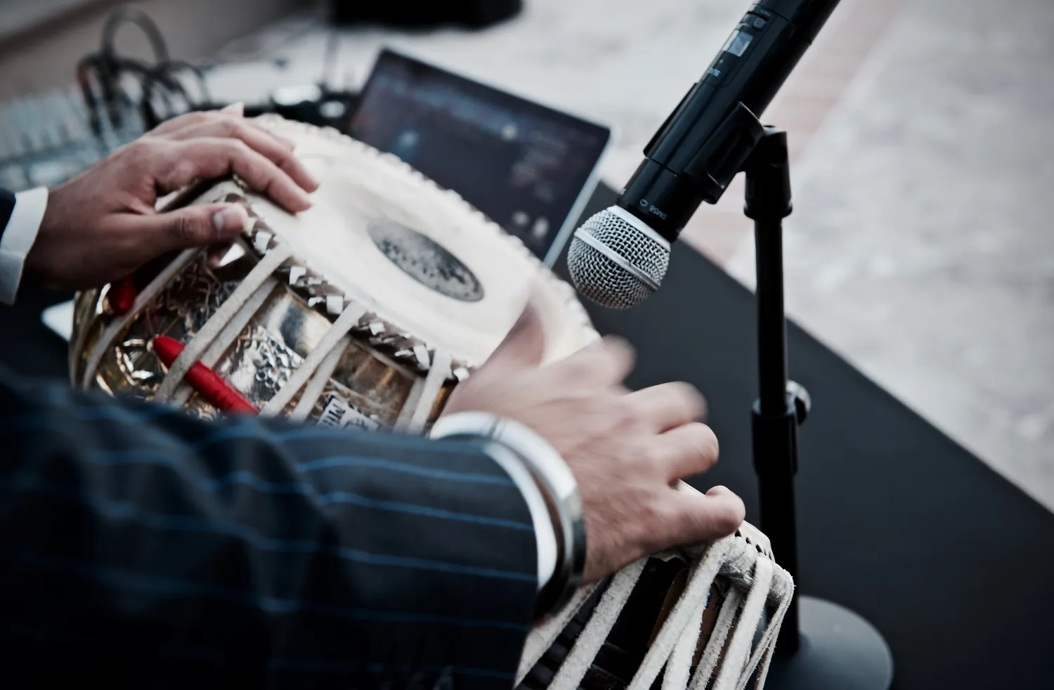 Tabla player's hands on a tabla drum at a Puerto Vallarta wedding.