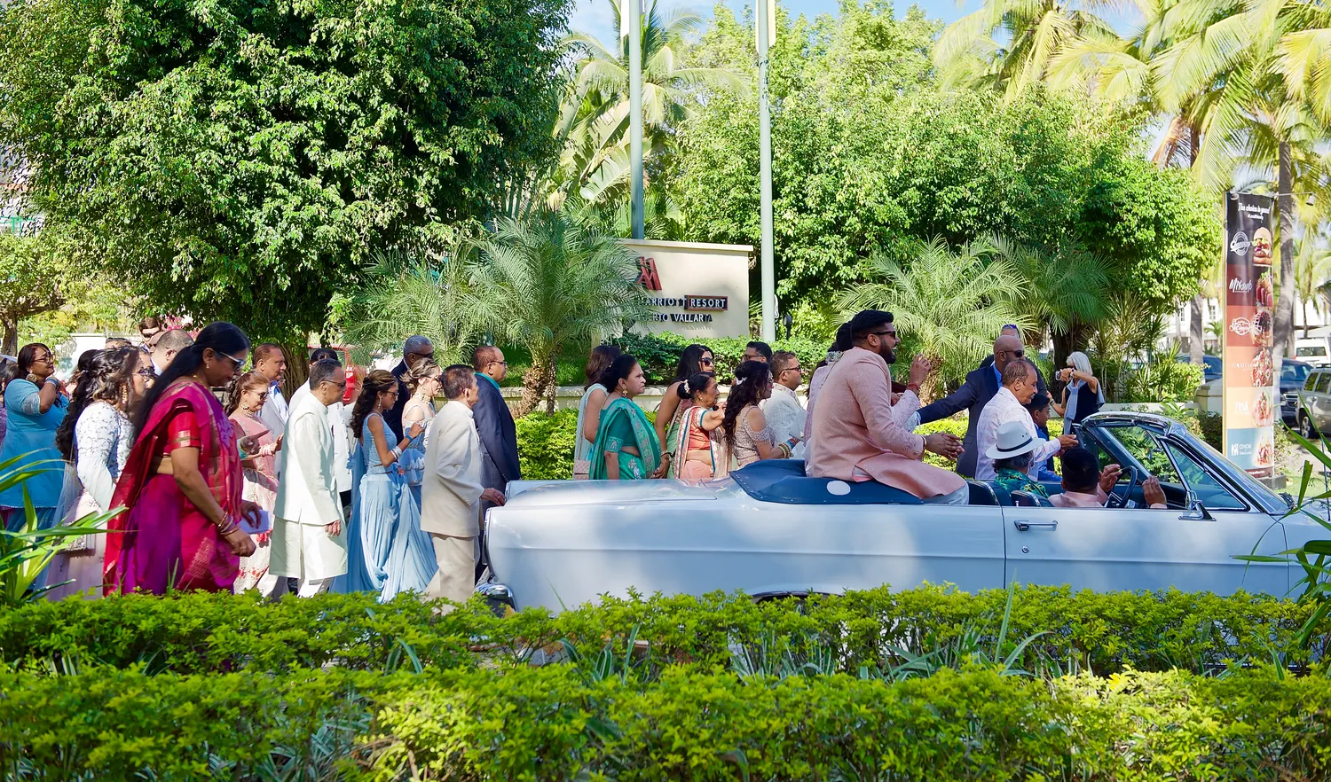 Wedding party procession at Marriott Puerto Vallarta Resort. Destination wedding in Mexico.