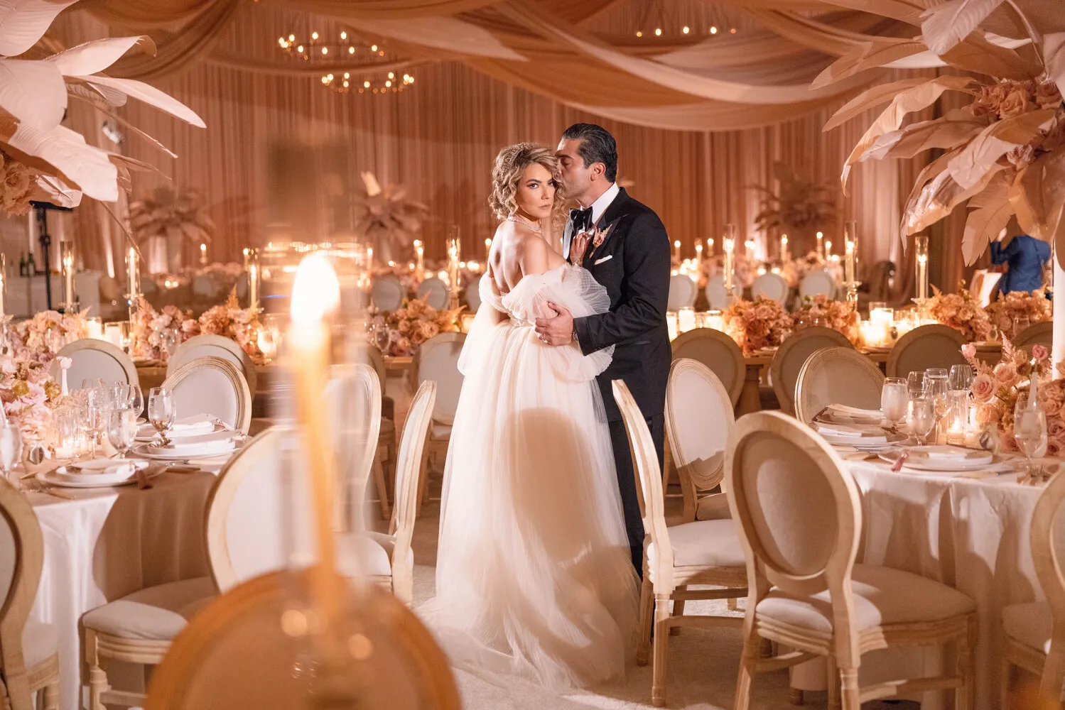 Bride and groom embrace at their elegant Beverly Hills wedding reception at the Maybourne Beverly Hills.