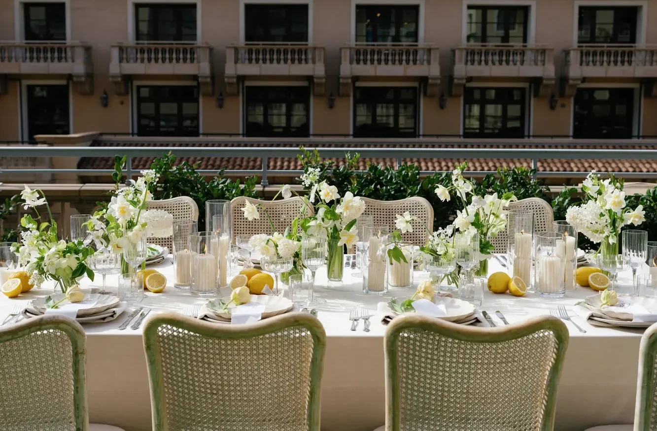 Elegant outdoor wedding reception at the Maybourne Beverly Hills, featuring white flowers and lemons.