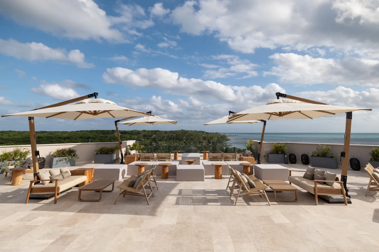 Luxury rooftop lounge at Almare Isla Mujeres resort with ocean views. Perfect for a wedding.