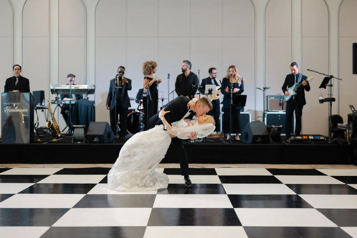 Bride and groom share a kiss on the dance floor at their Fort Lauderdale wedding reception.