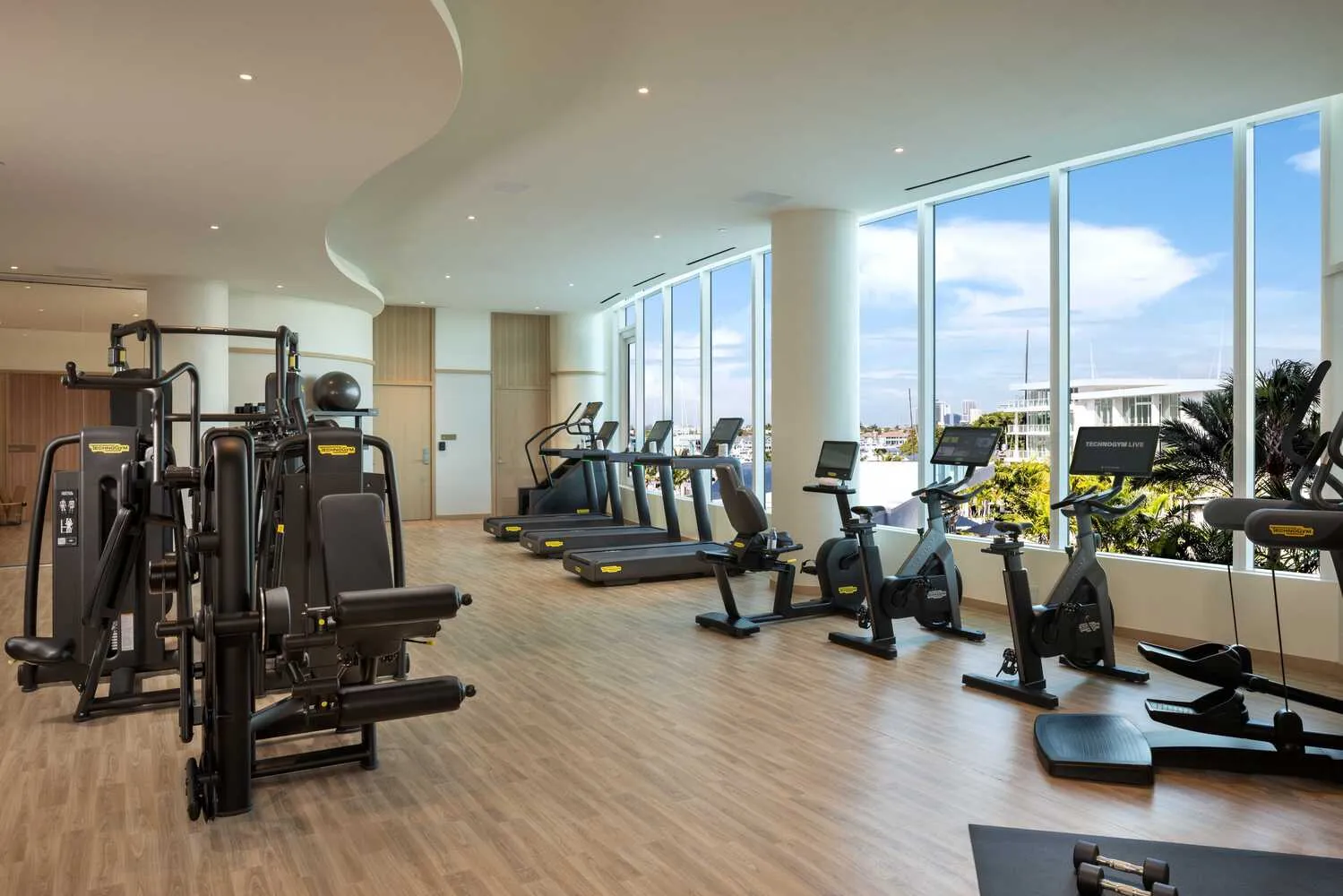 Modern gym with cardio machines and a view in Fort Lauderdale wedding venue