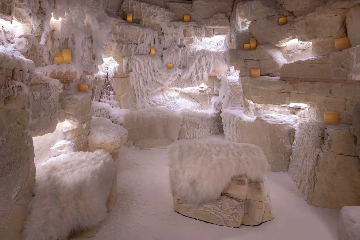 Cozy snow-themed room with soft seating and ambient lighting