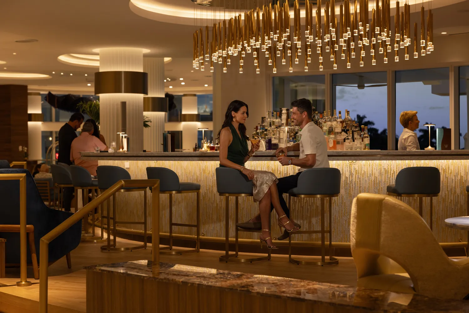 Couple enjoying drinks at an elegant bar in Fort Lauderdale wedding venue