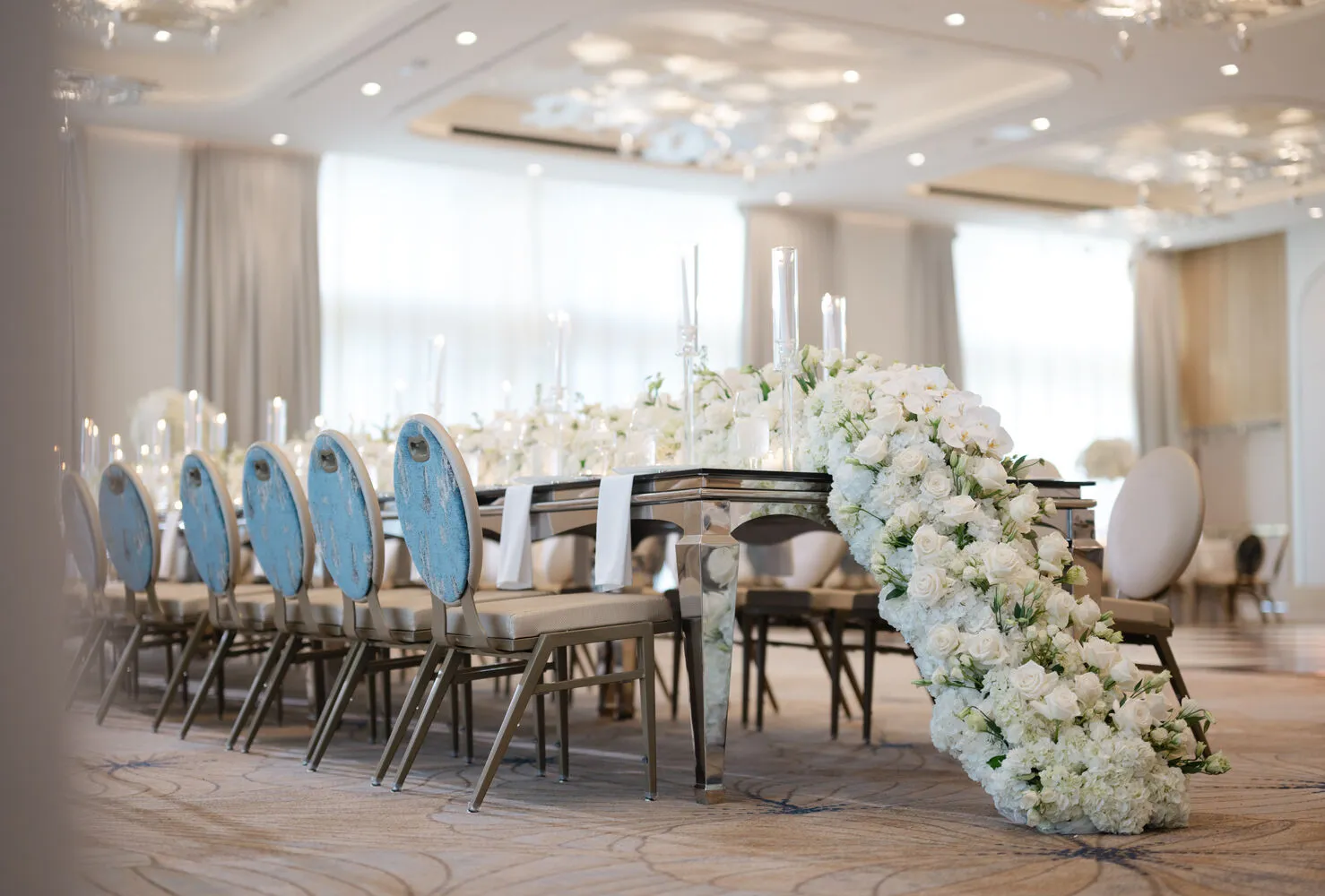 Elegant Fort Lauderdale wedding venue setup with white floral arrangements