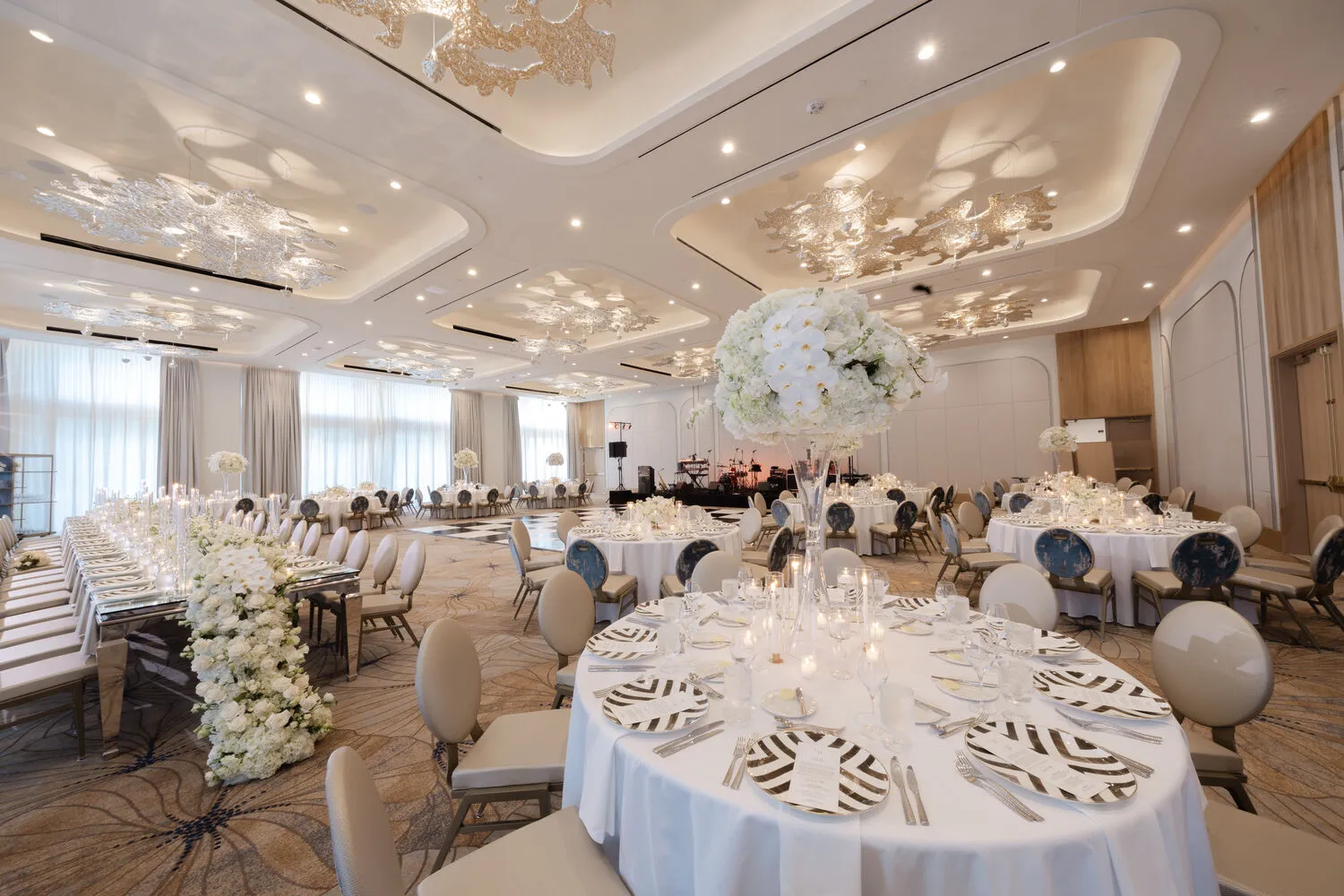 Elegant Fort Lauderdale wedding venue with decorated round tables and floral arrangements