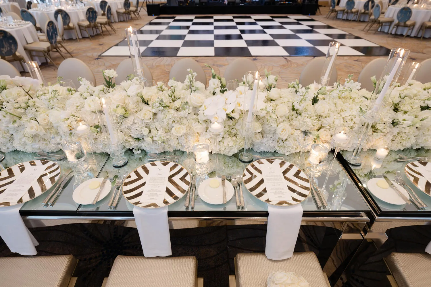 Elegant wedding reception setup at Fort Lauderdale venue with floral centerpieces