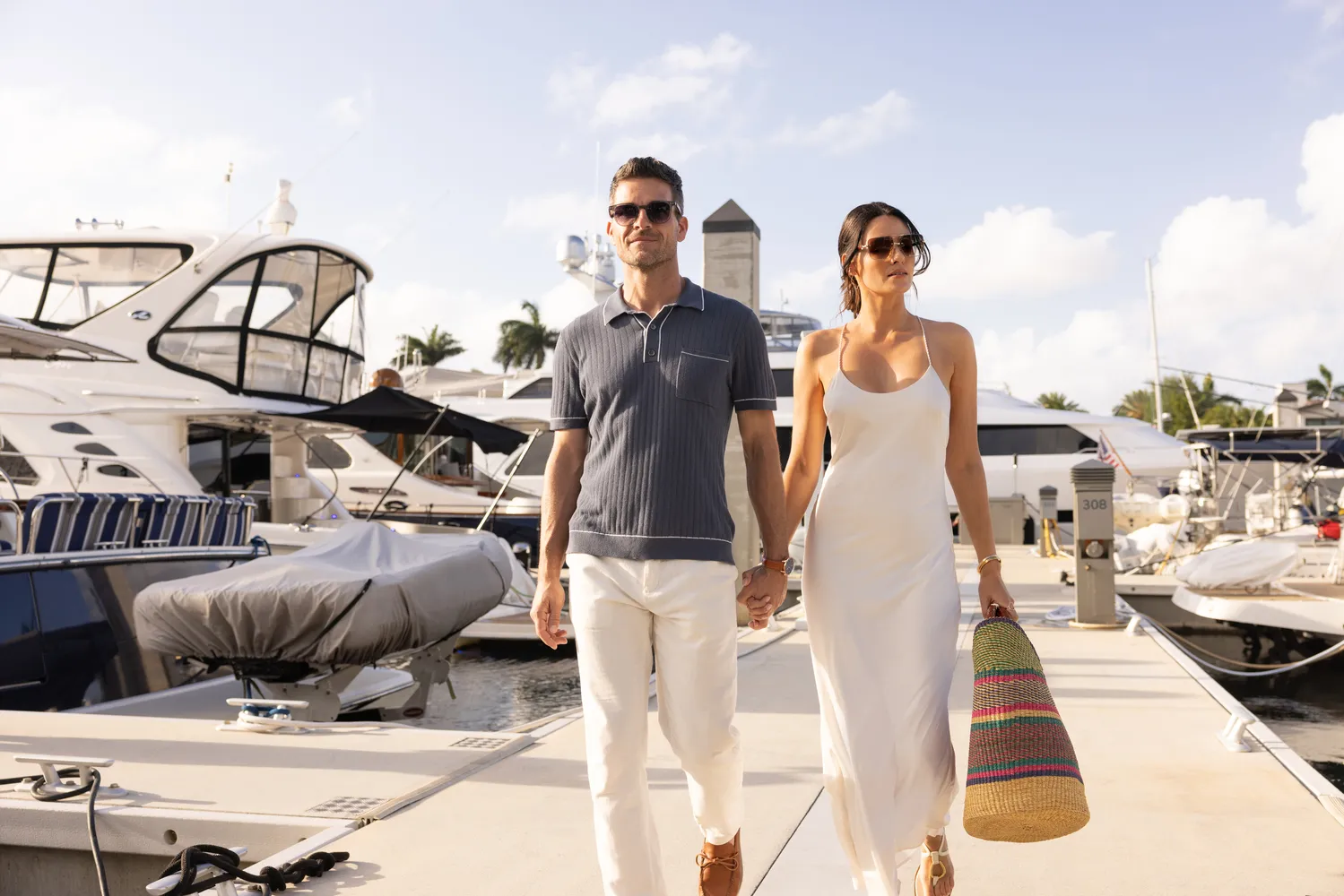 Couple walking on marina dock at Fort Lauderdale wedding venue